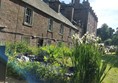 A building with a garden in front of it