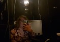 Image of a person looking in a mirror taken with no flash