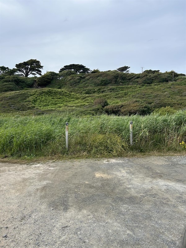 Image of a flat area of ground and some grass