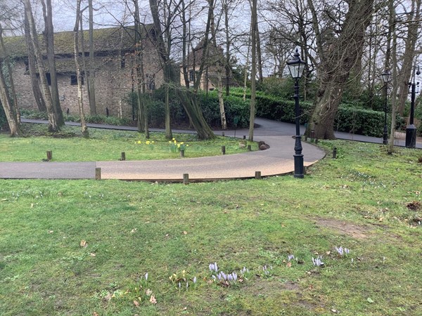 Continue your walk towards the stone buildings ahead