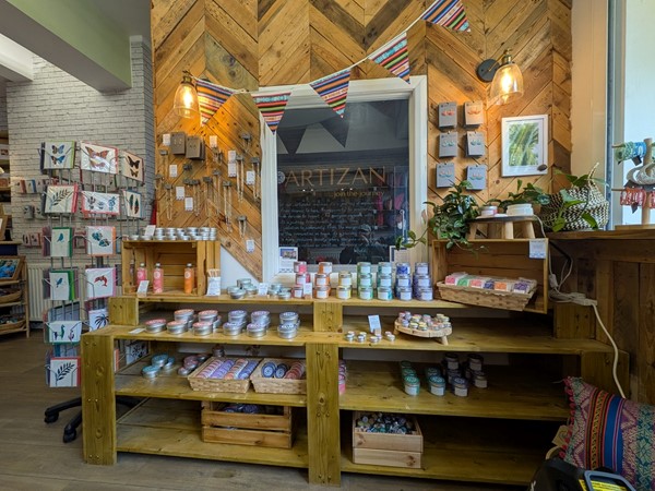 Image of counter with various items and jewellery to buy