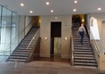 The lift and stairs from the foyer to the gallery.