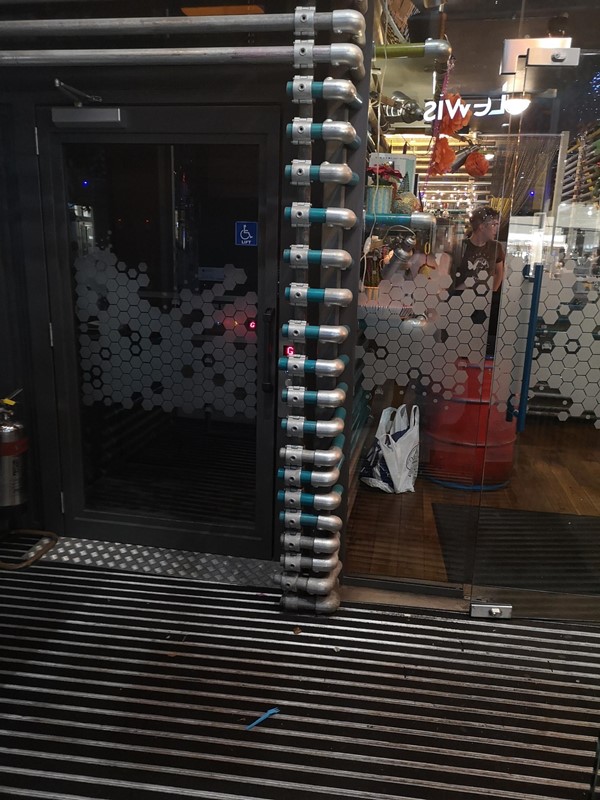 Entrance showing the lift and the door into the restaurant.