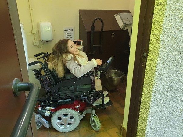 Image of disabled toilet showing size compared to wheelchair size.