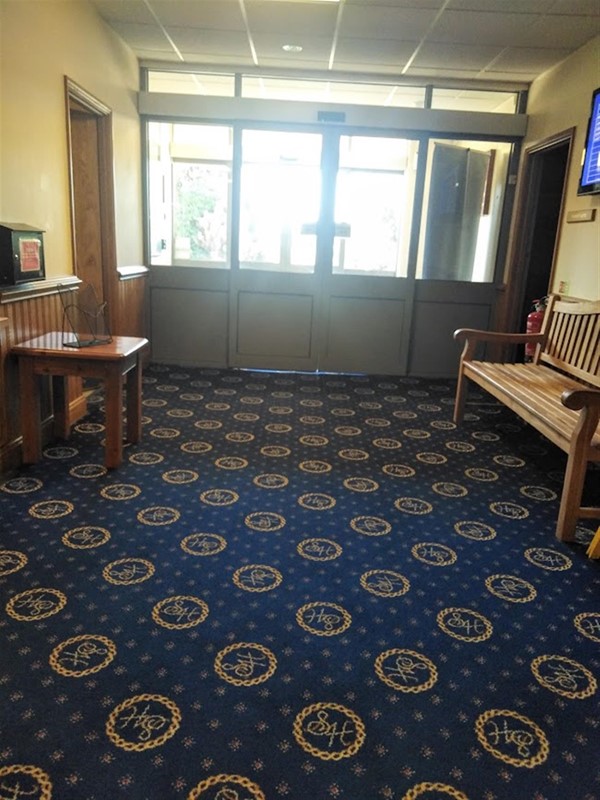Inside the entrance doors.