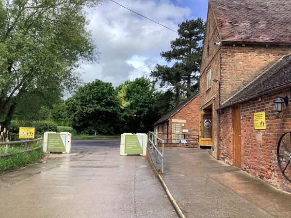 Picture of a road between red brick buildings