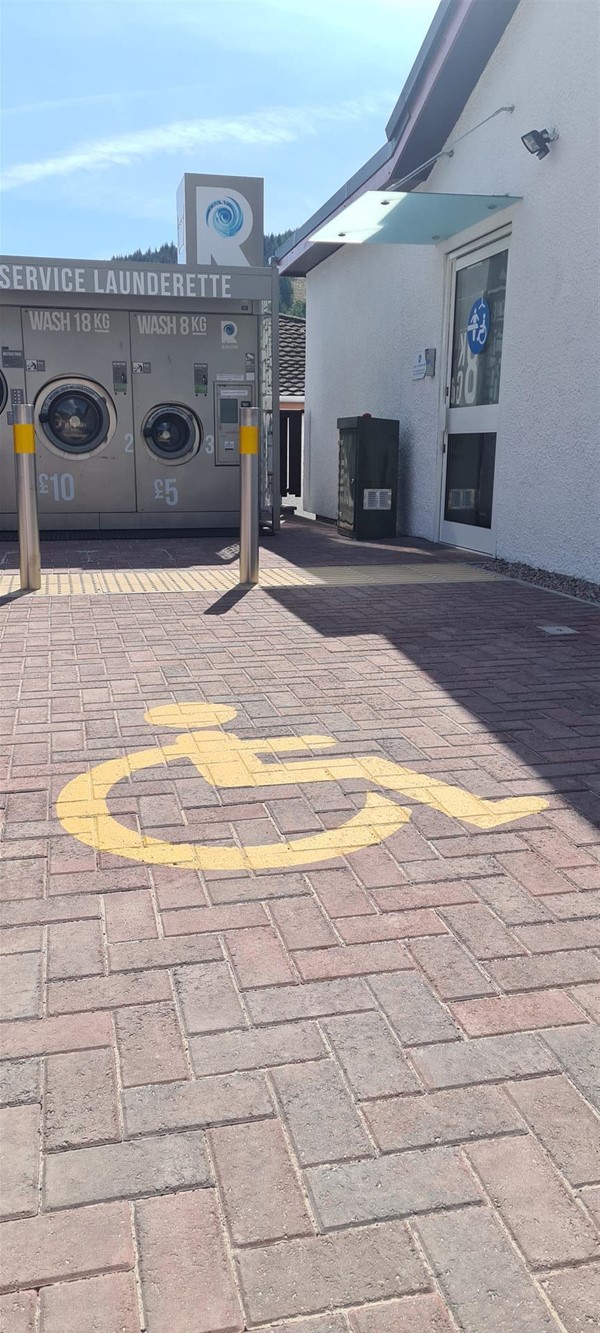 Side view of building that the CP Toilet is located.