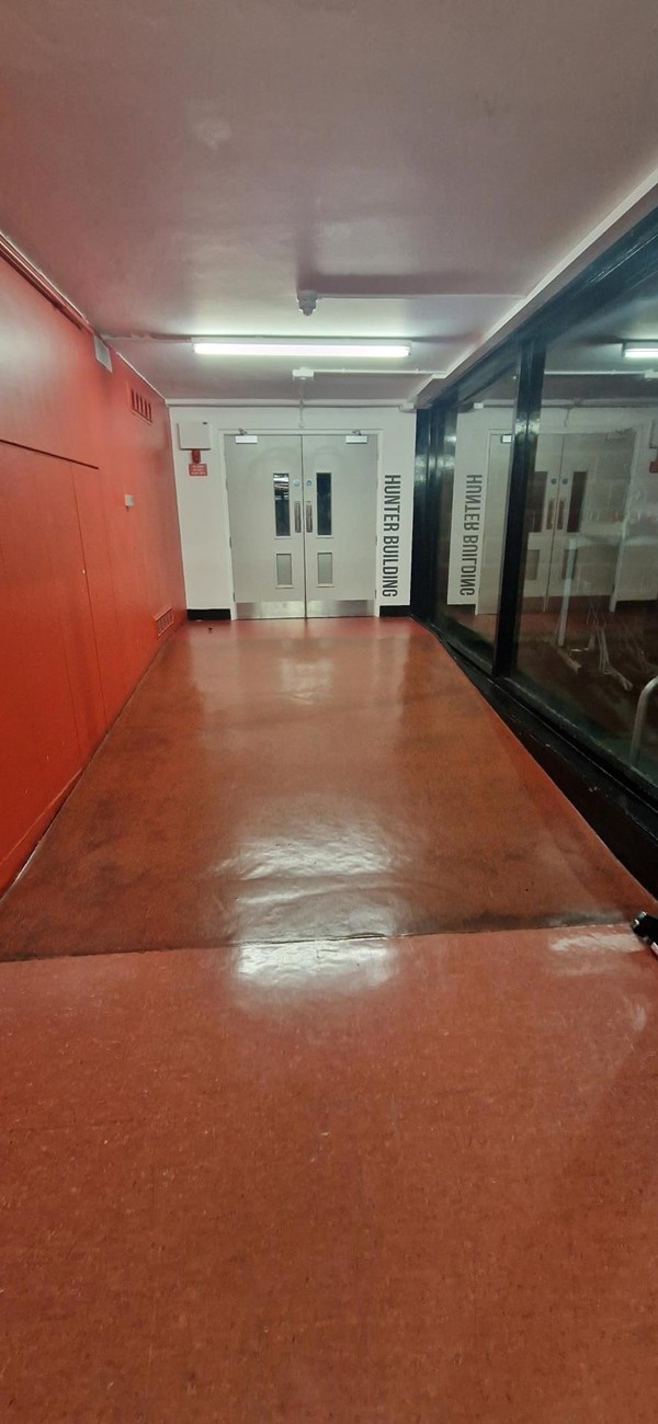 Inclined floor leading to Hunter Building. The accessible toilet is just on the other side of the doors.