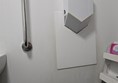 Image of a hand drier and a grabrail