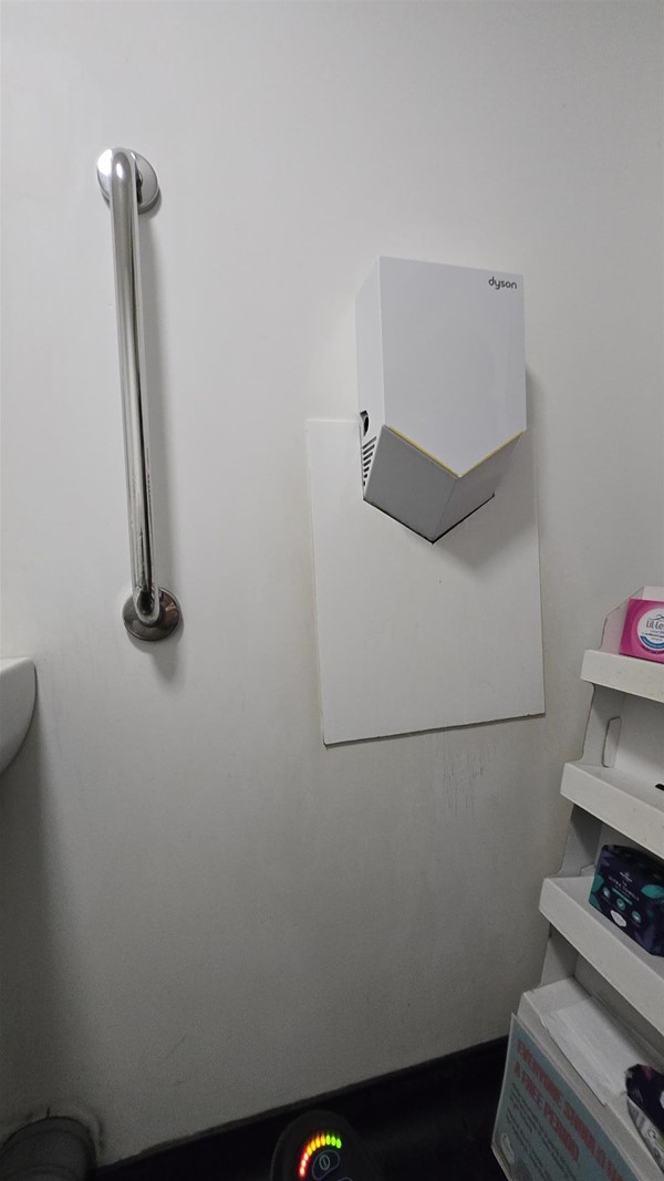 Image of a hand drier and a grabrail