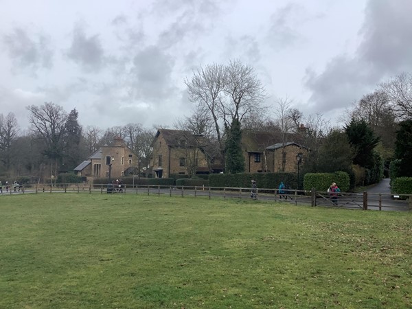 Just walk straight ahead to pass the delightful cottages and you will come out onto the main drive