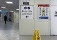 image of a sign pointing to the left reading “Hoist Toilet This Way”