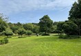 The grass slope to the first lake
