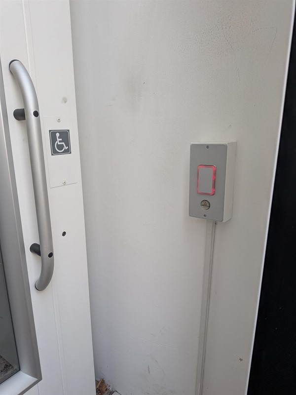 image of the door open button at the accessible entrance
