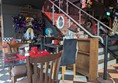 Image of seating area, some of the seats have plastic skeletons sitting in them