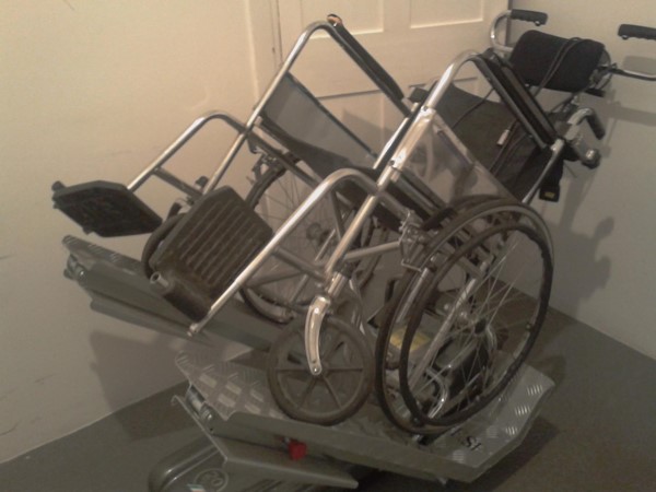 Stair climber wheelchair in accessible toilet