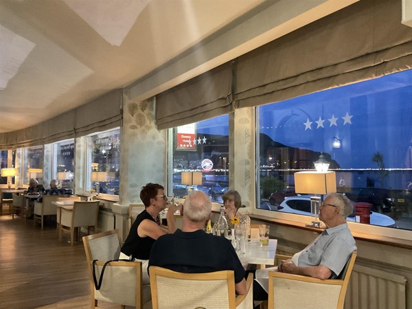 Image of people sat in a bar
