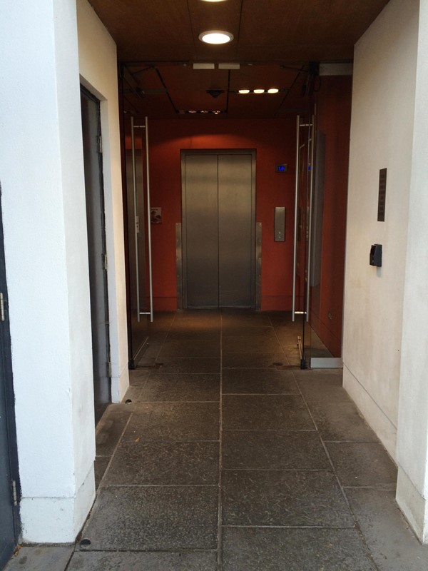 Lift with corridor doors propped open.