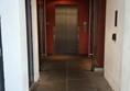 Lift with corridor doors propped open.
