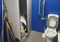 Picture of disabled toilet being used as a store cupboard