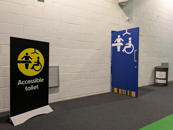 Image of entrance to the Changing Places toilet, with accessible toilet signage.