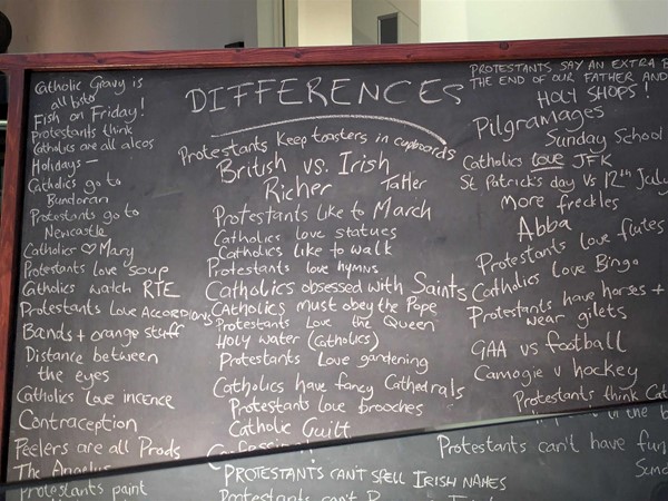 Image of Blackboard from the TV Sitcom Derry Girls, from an episode about the difference between Catholics and Protestants
