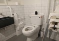 The disabled toilet as seen from the door.