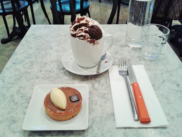 Hot chocolate with cream and mini chocolate muffin and cake