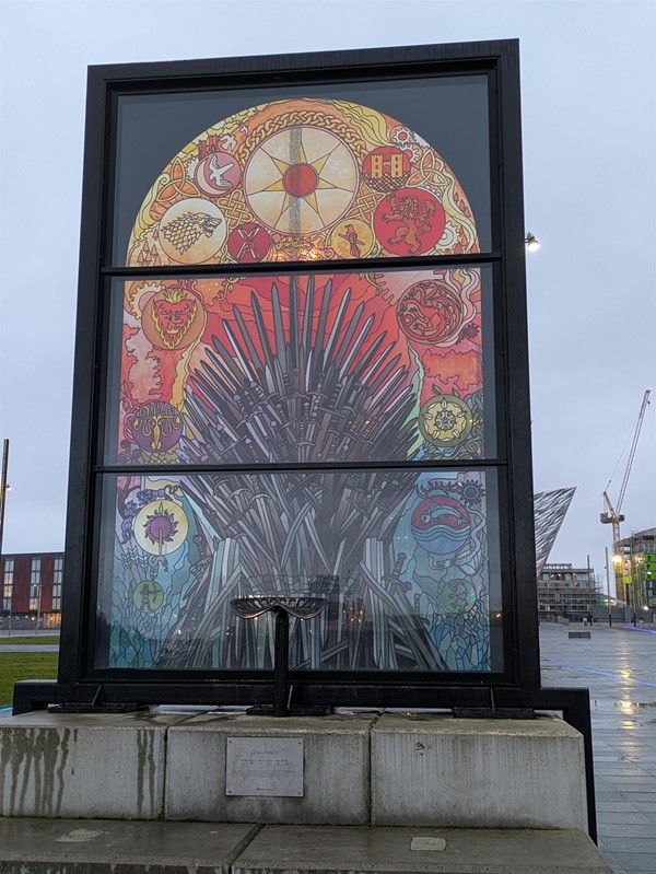 Image of a glass window by the Riverside showing the Iron Throne from Game of Thrones