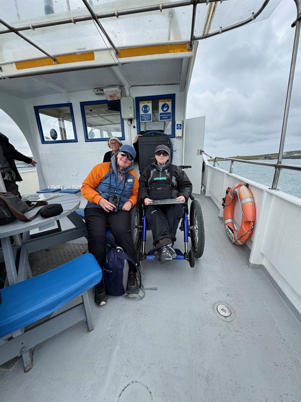 Image of two people on deck