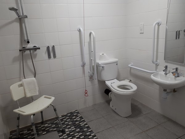 Clean spacious wheel in shower room