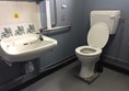 Image of an ccessible loo, there was a second pull down grab rail on the other side of the toilet which is out of the frame of the photo.