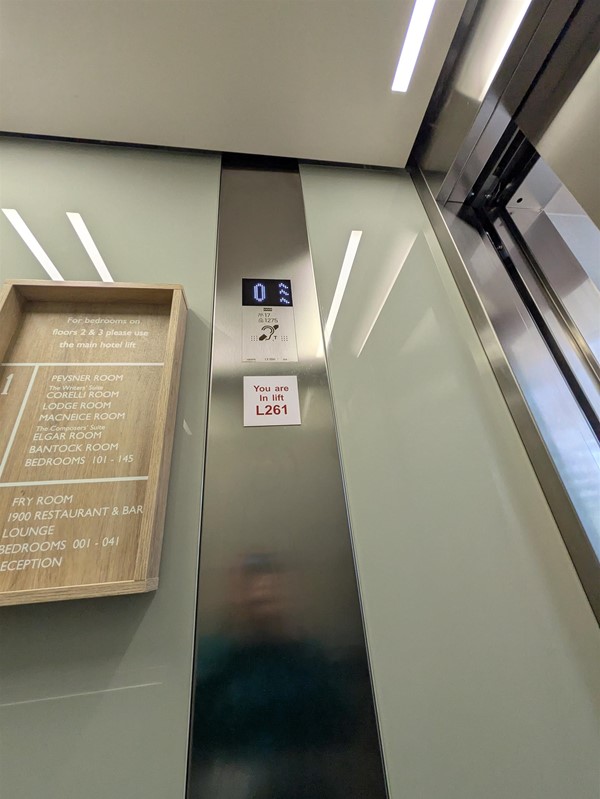 Image of lift buttons. The lift buttons have braille markings