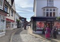 Picture of a cobbled road winding between buildings