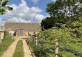 Image of a path leading to a barn
