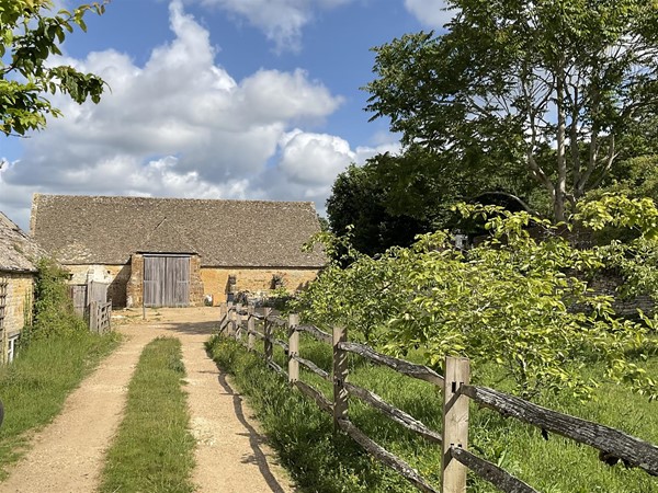 Image of a path leading to a barn