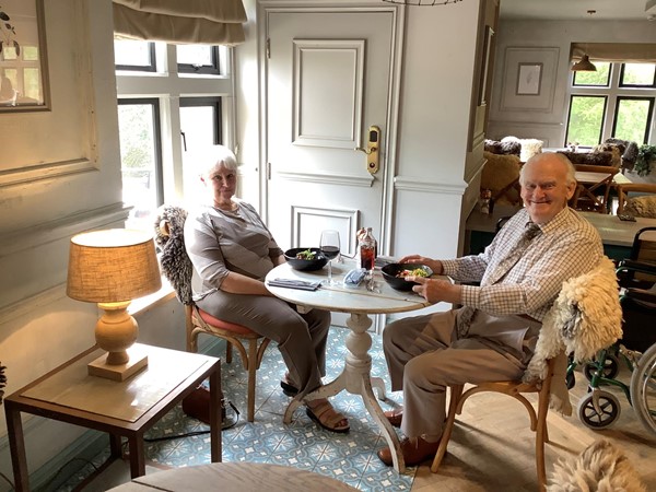 Picture of two people sitting in the dining area
