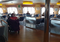 Image of a wheelchair user in a ferry cafe