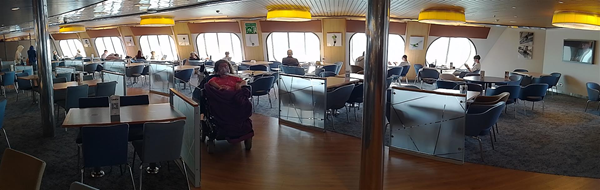 Image of a wheelchair user in a ferry cafe