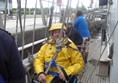 A wheelchair user rigged to go aloft.