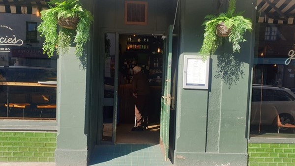 Picture of the door entrance to Gracie's