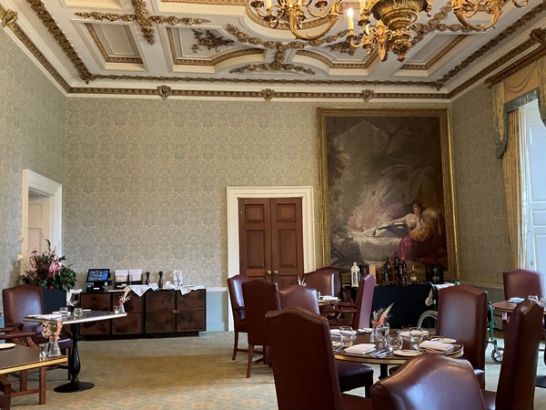 Image of a room with a large painting on the wall