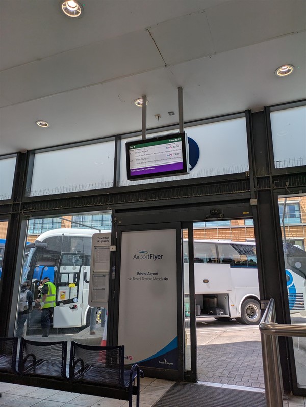 Image of overhead signage at automatic doors