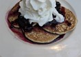 Pancake stack with blueberry compote,  an example of sweet delights.