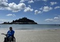 Image of a wheelchair user on a beach