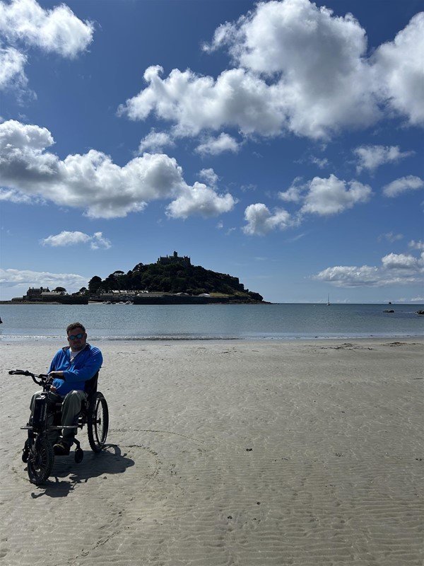 Image of a wheelchair user on a beach