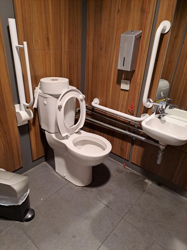Baggage Reclaim area, accessible toilet.  Dirty floor,  26th May 2024.