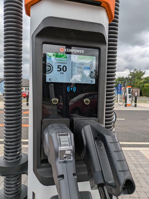 Image of EV terminal screen with charging cables