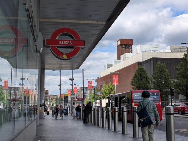 Image of bus station with buses sign
