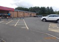 Car park the Blue Badge spaces are along the wall of the store